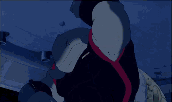 a close up of a cartoon character with a red ribbon around his waist