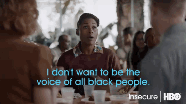 a group of people sitting around a table with the words i do n't want to be the voice of all black people ..