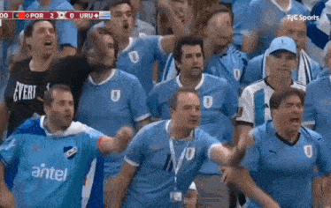 a group of men wearing blue shirts with antel on them
