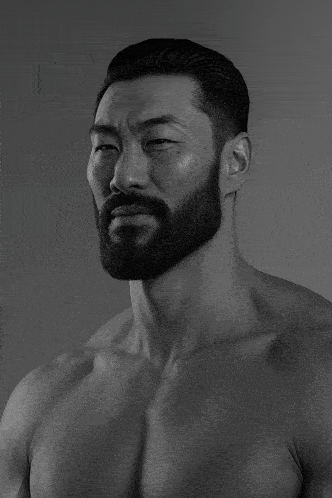 a man with a beard has his eyes closed
