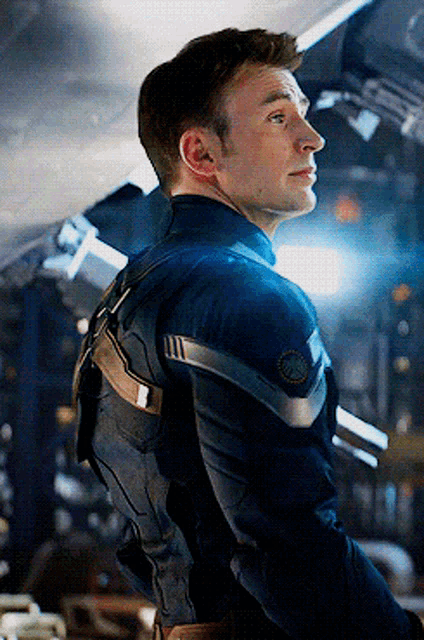 a close up of a man in a superhero uniform