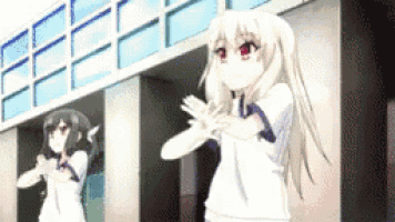a couple of anime girls are standing in front of a building with their hands in the air .
