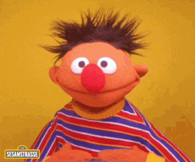 ernie from sesamstrasse is giving a thumbs up
