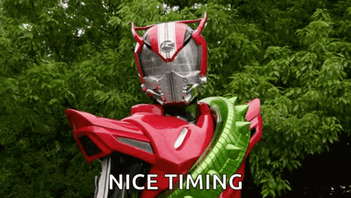 a red robot with the words nice timing on the bottom