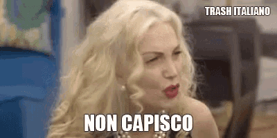 a woman with blonde hair and red lips is making a funny face and says non capisco .