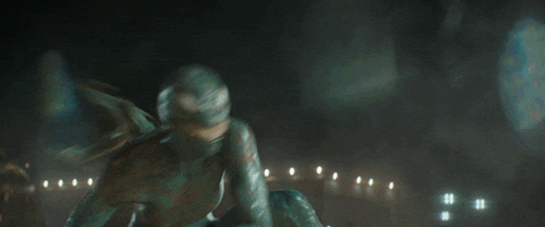a monster is flying through the air while another monster looks on