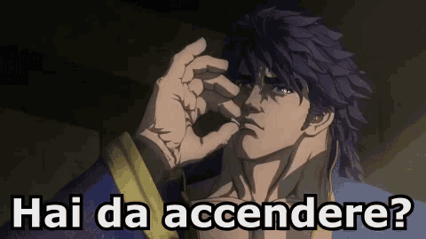 a man with purple hair is making a funny face with the words hai da accendere written below him
