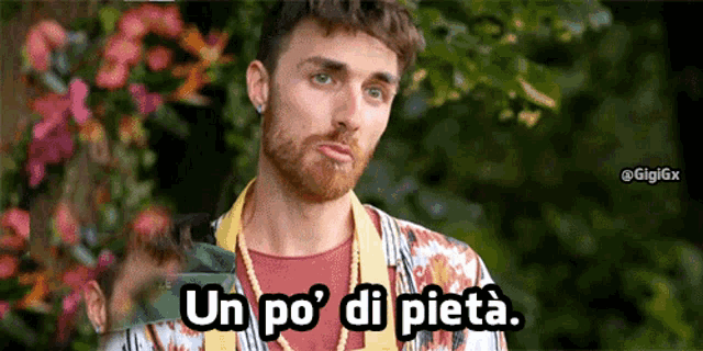 a man with a beard says un po ' di pieta in a foreign language