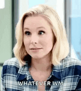 a woman in a plaid shirt is making a funny face and says `` whatever wm '' .