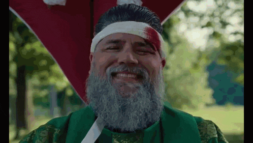 a man with a beard and a bandage on his head