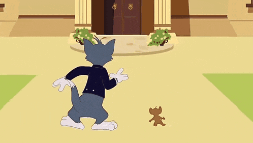 tom and jerry are dancing in front of a house