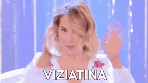 a woman is making a funny face and the word viziatina is on the bottom right