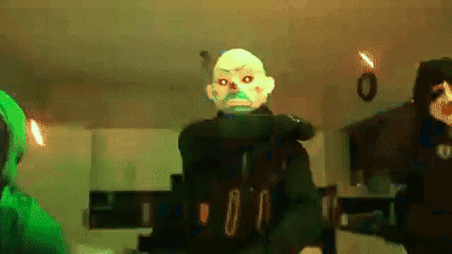 a man wearing a mask is standing in a dark room