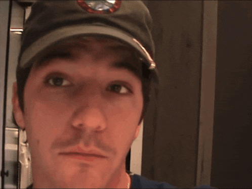 a man wearing a hat with the word main on it