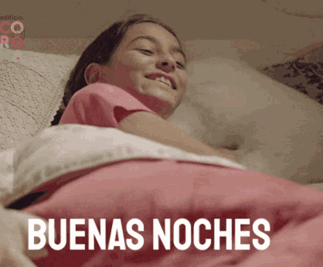 a girl is laying in bed with the words buenas noches written on the bottom