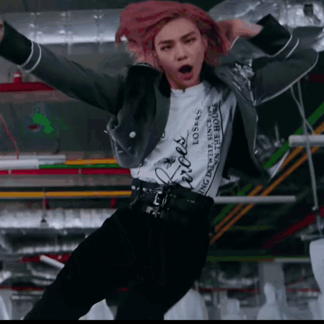 a girl with pink hair is wearing a shirt that says losers
