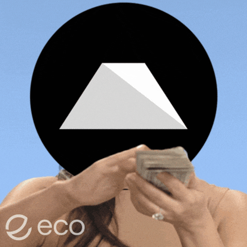 a woman is holding a stack of money in front of a black circle with a triangle on it