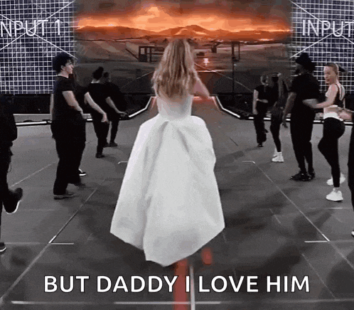 a woman in a white dress is dancing on a stage with the words but daddy i love him written on the bottom