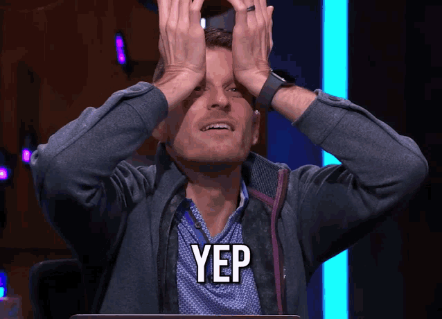 a man covering his eyes with his hands and the word yep is visible