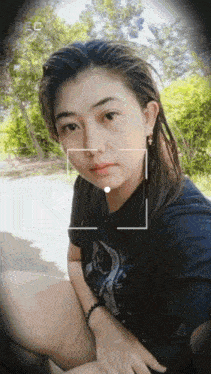 a woman is taking a selfie with a camera that says fc on it