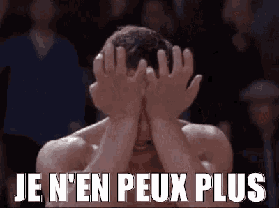 a man is covering his face with his hands and the words `` je n'en peux plus '' are written above him .
