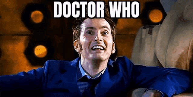 a man in a blue suit and tie is smiling with the words `` doctor who '' written on the bottom .