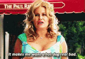 a woman says " it makes me want a hot dog real bad " in front of a paul restaurant