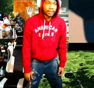 a man in a red american eagle hoodie
