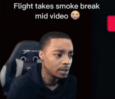 a man sitting in a chair with the words flight takes smoke break mid video on the bottom