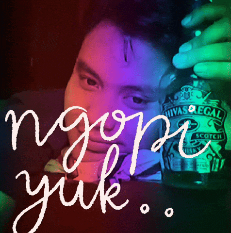 a man is holding a bottle of chivas regal scotch whisky