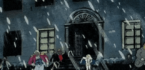 a group of people are standing in front of a building while snow is falling .