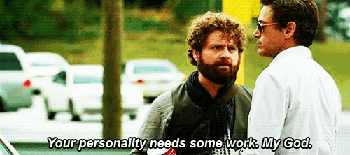 two men are standing next to each other and one of them is saying " your personality needs some work my god "