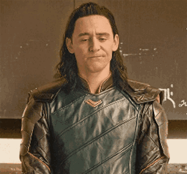 a man with long hair is wearing a leather jacket with a chevron on the front