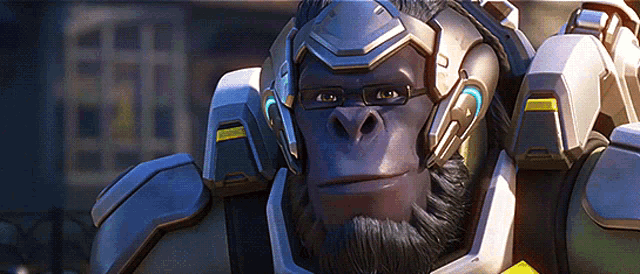 a gorilla with glasses and a beard is wearing a robotic suit