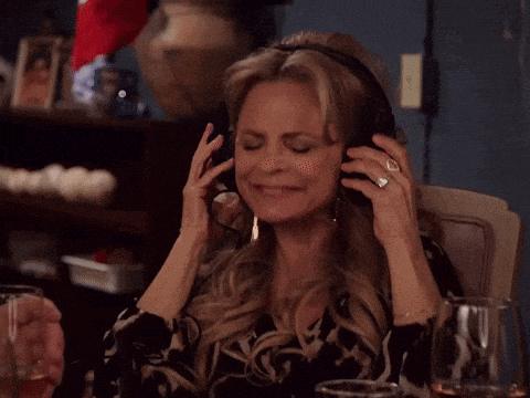 a woman wearing headphones and a ring on her finger