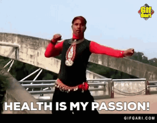 a man is dancing in front of a bridge with the words `` health is my passion '' written below him .