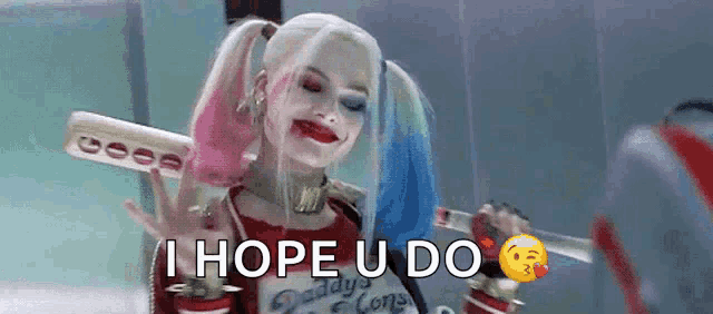 a woman in a harley quinn costume is holding a bat and says i hope you do .
