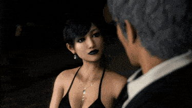 a woman in a black dress is looking at a man