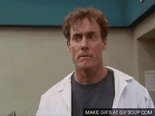 a man in a lab coat is making a funny face and says make gifs at gifsoup.com