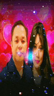 a man and a woman are standing next to each other in front of hearts