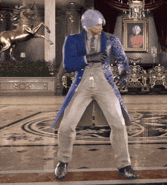 a man in a blue and white suit is dancing in a room