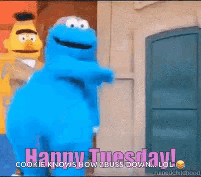 cookie monster from sesame street is standing in front of a door and says `` happy tuesday ! ''