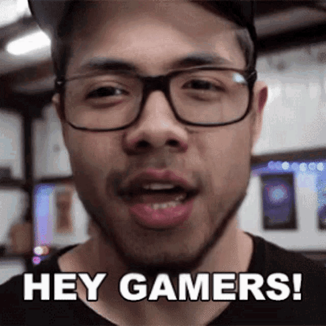 a man with glasses says hey gamers