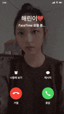 a woman in a brown sweater is on a video call on her phone