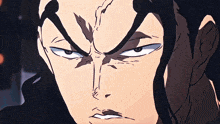 a close up of a man 's face with an angry look on his face
