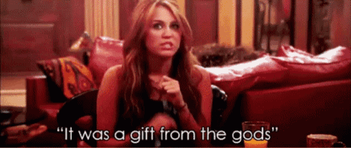 a woman sitting on a red couch says it was a gift from the gods