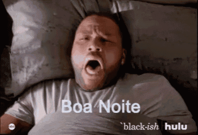 a man laying in bed with his mouth open and the words boa noite written on the bottom