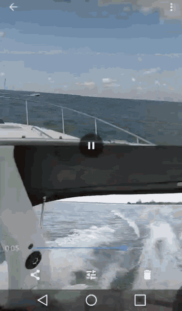 a video of a boat in the ocean is being played on an app