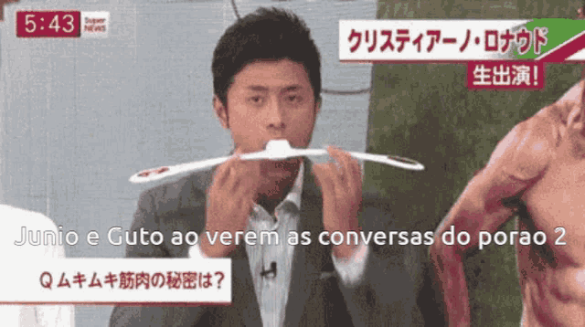 a man in a suit is holding a toothbrush in his mouth in front of a man in a muscle suit