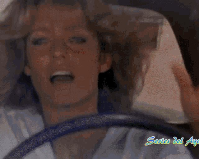 the name jaclyn smith is on a blue background with a car in the background